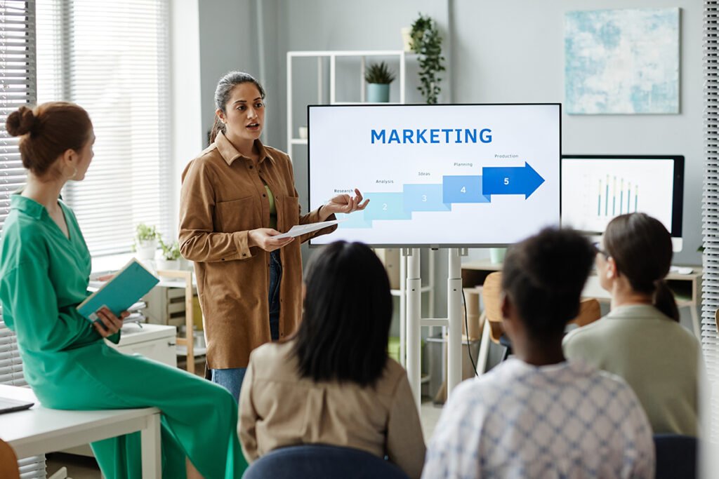 Five teammates working in a digital marketing agency