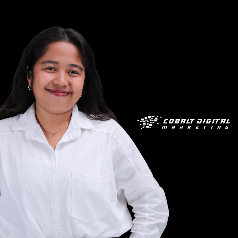 Smiling woman in a white button-up shirt poses against a black background with the Cobalt Digital Marketing logo to her right.